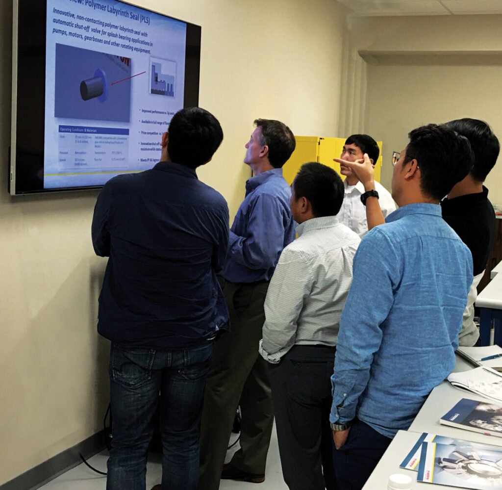 Group of people looking at a presentation