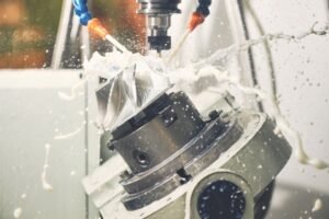 CNC 5-axis machining of an aluminium impeller with Opticool 462 metalworking fluid spraying across the workpiece